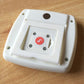 White digital kitchen timer back panel with mounting bracket and circular magnet