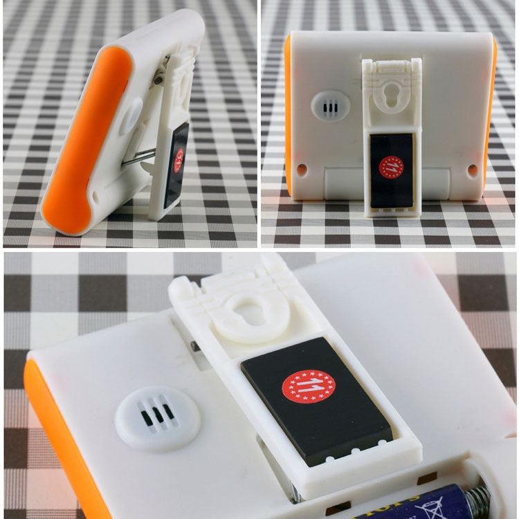 Digital kitchen timer underside with speaker grill and battery compartment cover, plus magnetic backing