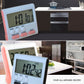 Digital kitchen timer with LCD time display and red/gray buttons, shown at an angle