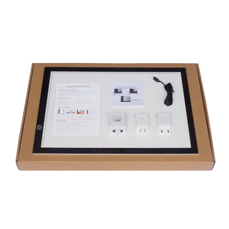 LED USB tracing lightbox kit in box with instruction sheets, power adapter and cable