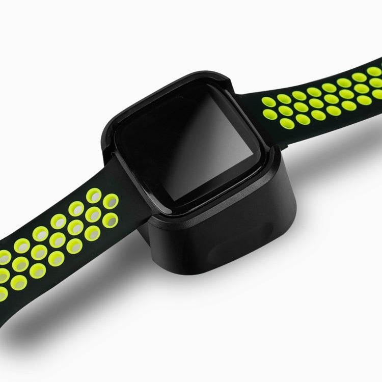 Black charging dock fitted on neon green smartwatch band