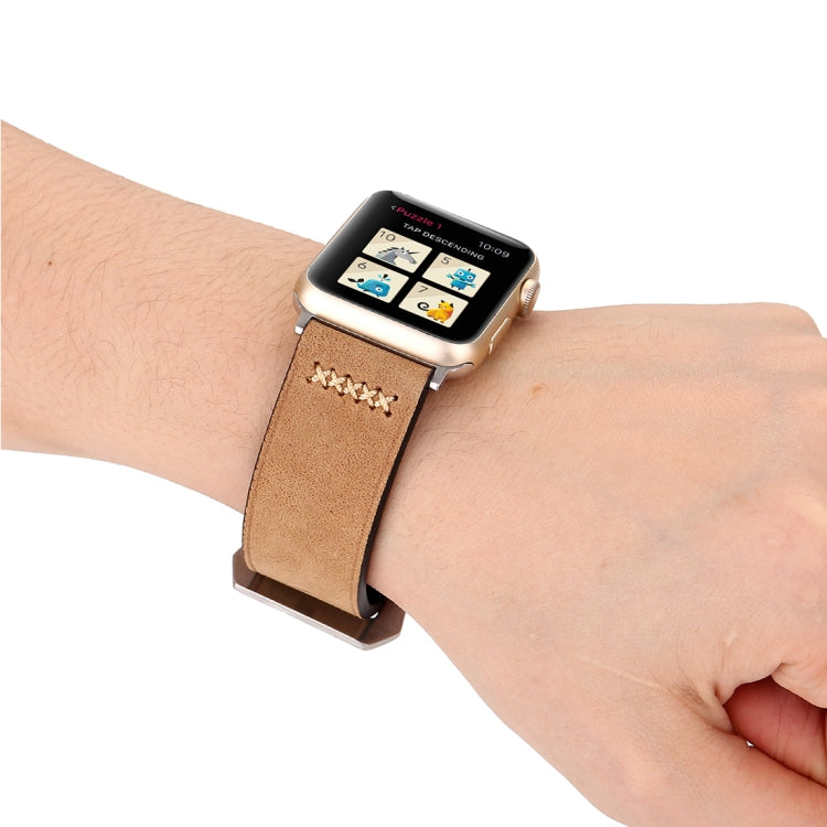 Genuine leather Apple Watch wrist band on wrist, tan strap with silver buckle and stitched detail