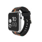 Silicone camouflage watch band with orange-red and teal pattern on black watch