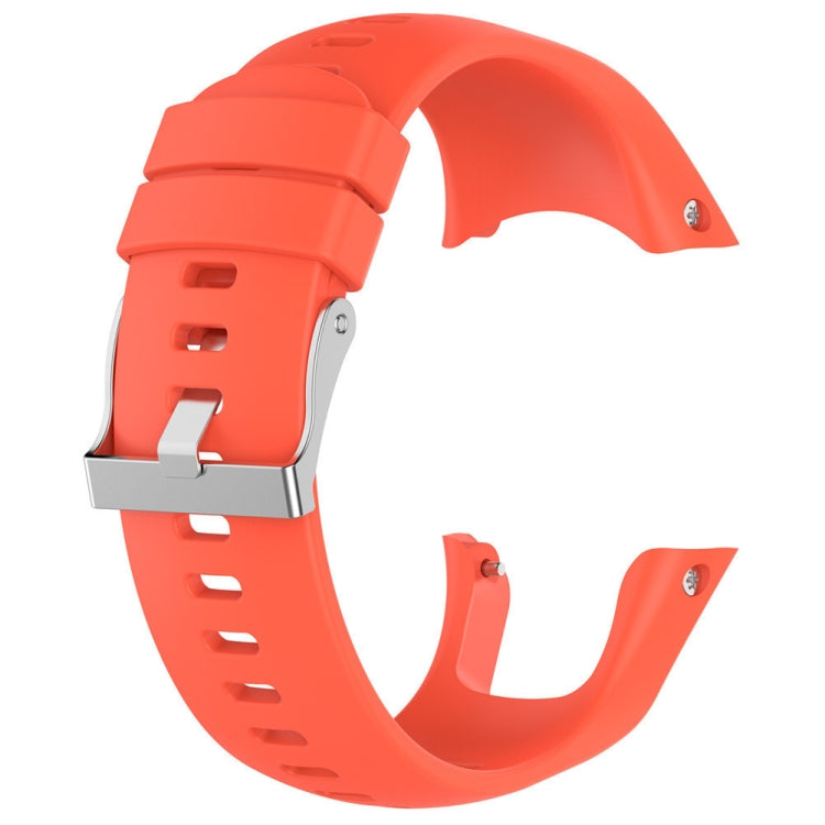 Orange silicone watch band with metal buckle and punched strap holes.