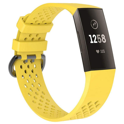 Yellow perforated sport watch band with adjustable strap and textured clasp area.