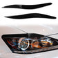 Black ABS headlight eyebrows with installed trim over front headlight