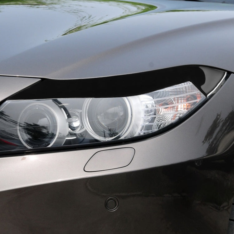 Black light eyebrow trim mounted on front headlamp housing
