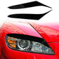 Black glossy headlight light eyebrow trim, mounted on red car headlamp