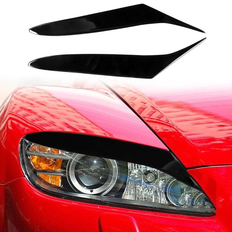 Black glossy headlight light eyebrow trim, mounted on red car headlamp