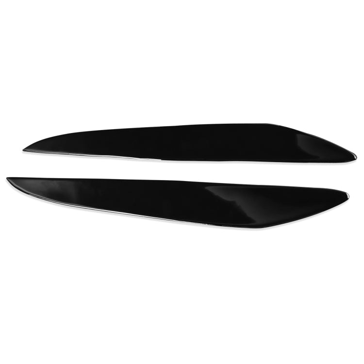 Pair of black ABS headlight eyebrow trims, curved over the lamp lens