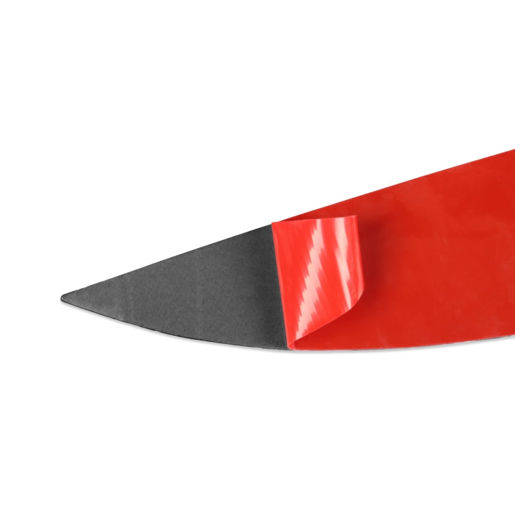 Black ABS headlight eyebrow trim with glossy red protective film on one edge