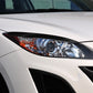Black headlight eyebrow trim installed above the car headlamp