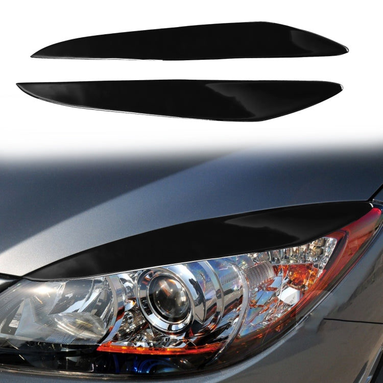 Black headlight eyebrow trim installed on the front headlamp