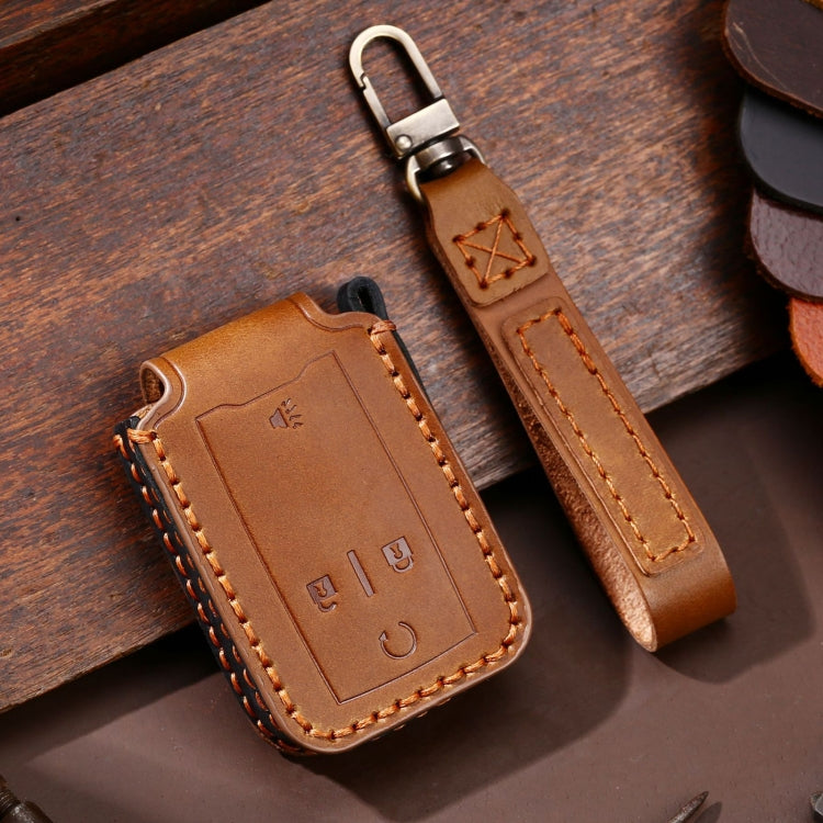 Brown leather 4-button car key protective case with key ring and contrast stitching