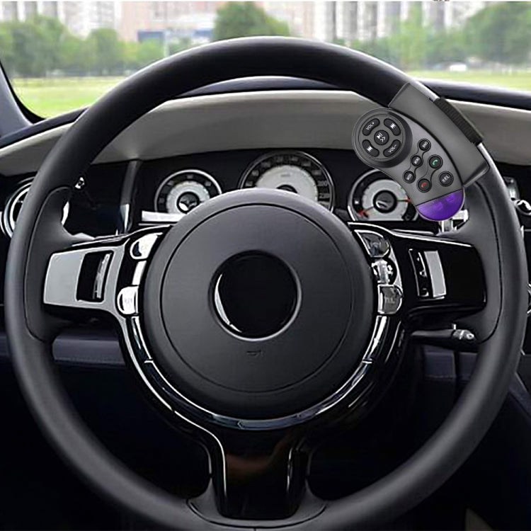 Multimedia remote mounted on car steering wheel, round controls and purple-lit panel