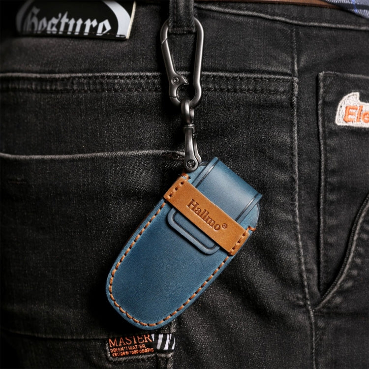 Blue leather key fob case clipped on jeans pocket with metal key ring and loop