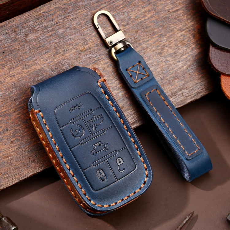 Blue leather key fob protective case with stitched edges and metal key ring