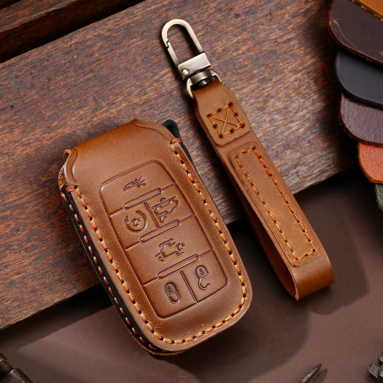 Brown leather key fob protective case with stitched edges and metal key ring