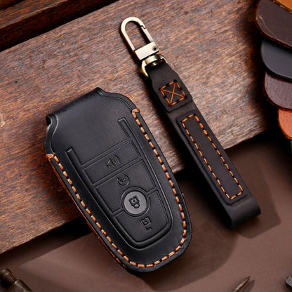 Black leather key fob protective case with orange stitching and key ring clip