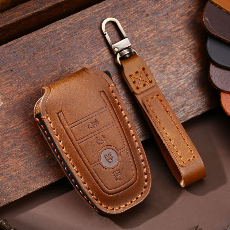 Brown leather key fob protective case with orange stitching and key ring clip