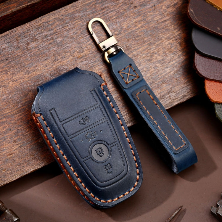 Blue leather key fob protective case with key ring, embossed buttons, orange stitching