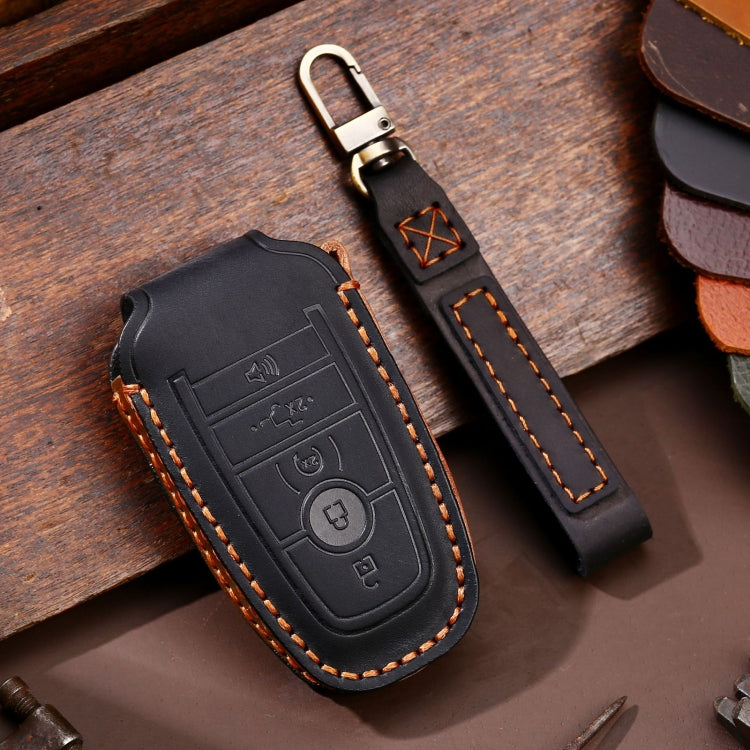 Black leather key fob protective case with stitched edges and metal key ring loop