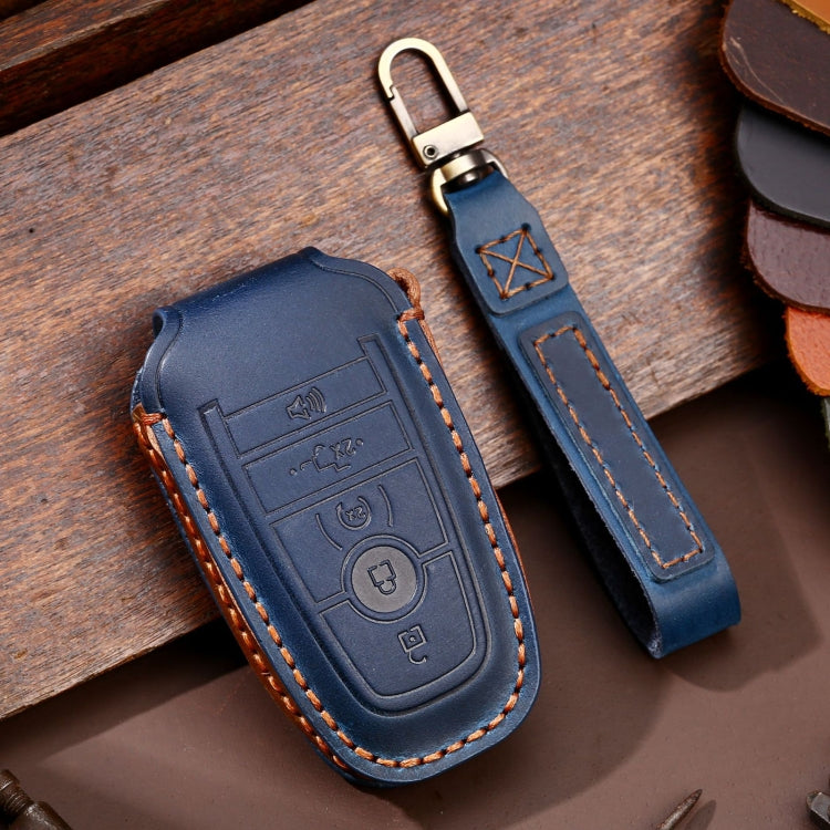 Blue leather key fob protective case with stitched trim and metal key ring loop