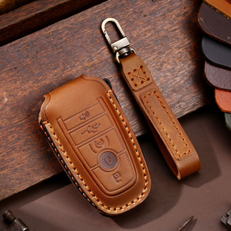 Brown leather key fob protective case with stitched trim and metal key ring loop