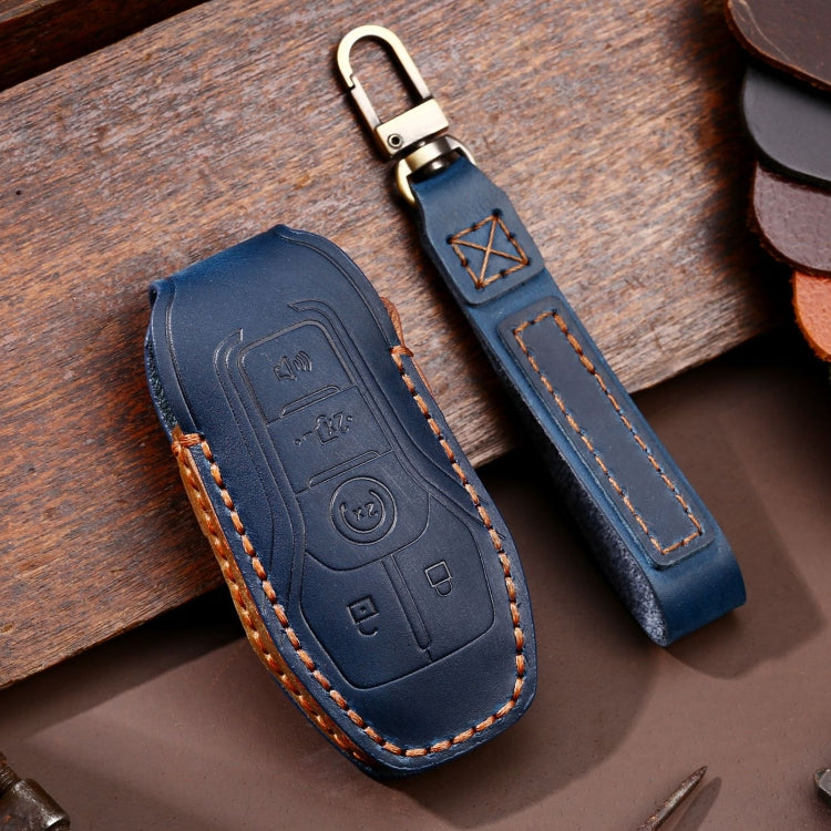 Blue 3-button key leather protective case with metal key ring and contrast orange stitching