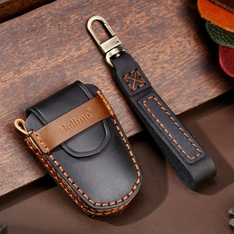 Leather car key cover with tan button panel, keyring loop, and contrast stitching