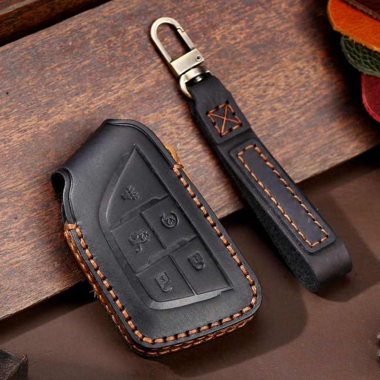 Black leather car key protective case with stitched edges and metal key ring