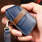 Blue leather key fob case with brown stitched trim and metal key ring