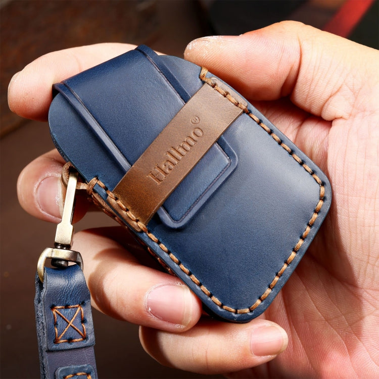 Blue leather key fob case with brown stitched trim and metal key ring
