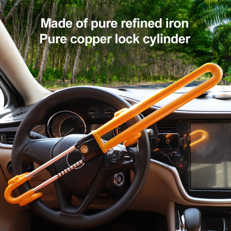 Orange-yellow steering wheel anti-theft lock across steering wheel with key side