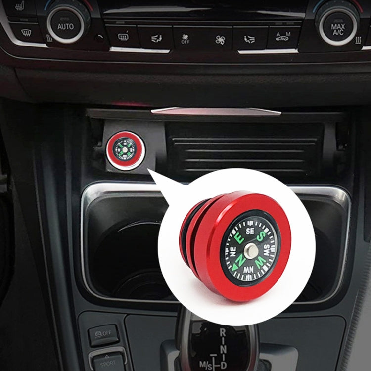 Red metal cigarette lighter dust cover with compass-style dial on top