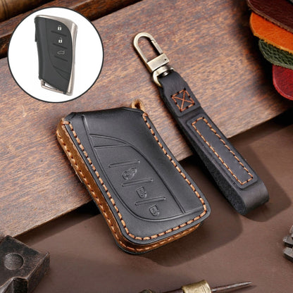 Black cowhide leather key fob cover with 3-button icons, metal ring, and tan stitching