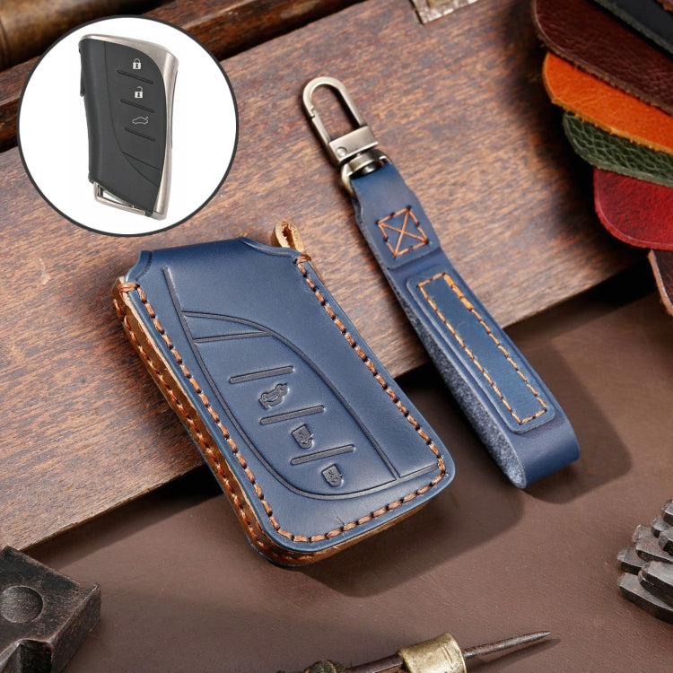 Blue cowhide leather key fob cover with 3-button icons, metal ring, and tan edge stitching