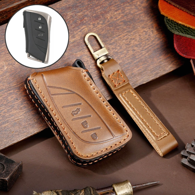 Brown cowhide leather key fob cover with 3-button icons, metal ring, and tan stitched edge
