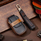 Black leather key fob cover with contrast stitching and key ring loop