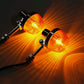 Two amber LED motorcycle turn signals glowing, chrome housings with front mounting arms