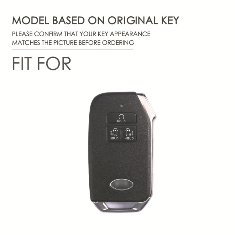 Black leather key fob cover with button area and key ring attachment