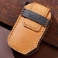 Tan leather key fob cover with black top panel and Hallmo logo patch