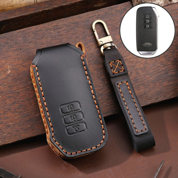 Black leather key fob cover with metal key ring and orange edge stitching, 3-button style