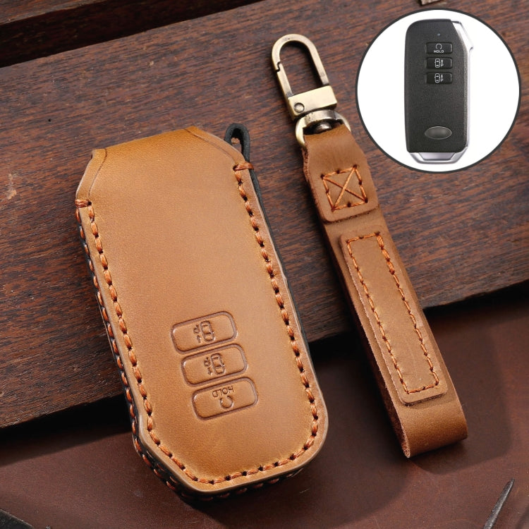 Brown leather key fob cover with metal key ring and orange edge stitching, 3-button style