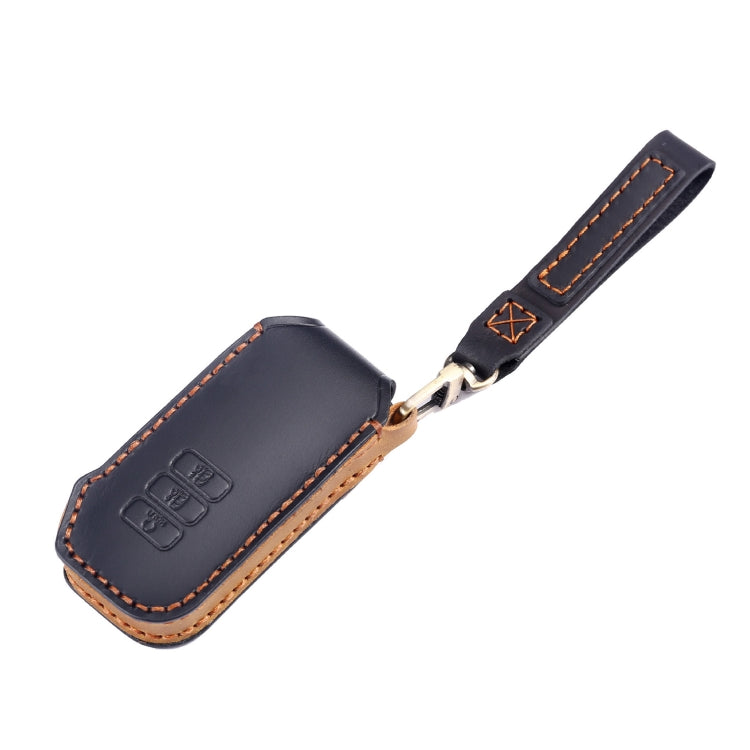 Blue leather key fob cover with metal key ring, embossed buttons, and orange stitching