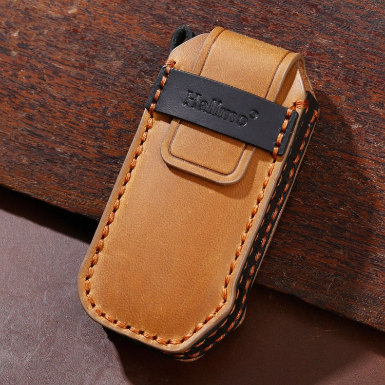 Tan leather key fob cover with metal key ring, embossed logo, and orange border stitching