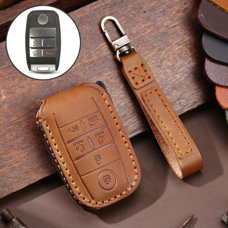 Brown leather car key protective cover case with orange stitching and metal key ring