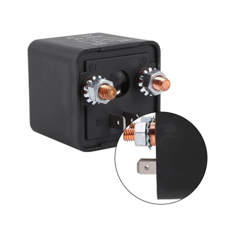 Black relay base with two metal terminals and a diagram label on the cover