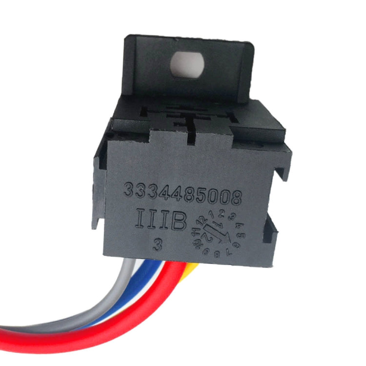 Black automotive relay with printed markings and red, blue, and white wire leads
