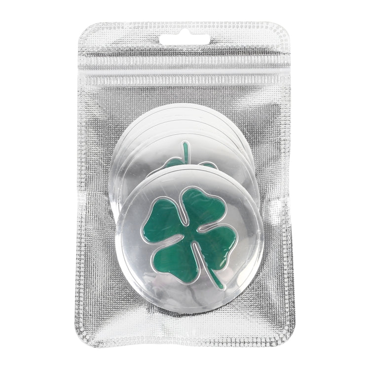 Car wheel hub sticker in package: round silver backing with green four-leaf clover